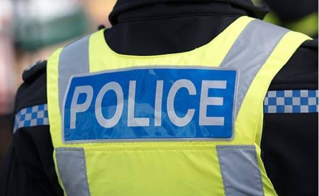 A Skegness police officer has been suspended after being charged with two offences.