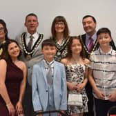New Mayor of Skegness Coun Adrian Findley (back row centre), Mayoress Coun Sarah Staples (left), Deputy Mayor Coun Jimmy Brookes and Mayoress Emma Brookes with their families.