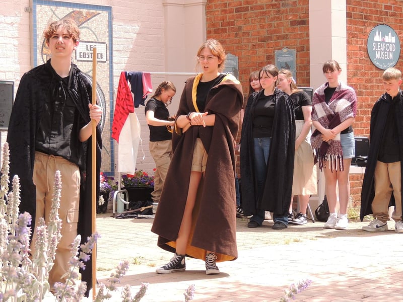 School sixth formers perform plays based on the town's history outside Sleaford Museum.