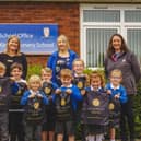l-r - Jackie Anderson, Miss Goodley, Jemma Wells and Lucy Lee with pupils of Kirton Primary School