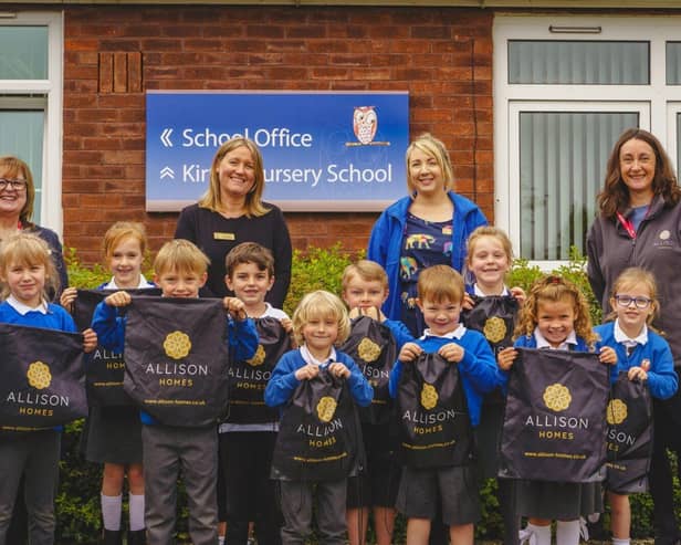 l-r - Jackie Anderson, Miss Goodley, Jemma Wells and Lucy Lee with pupils of Kirton Primary School