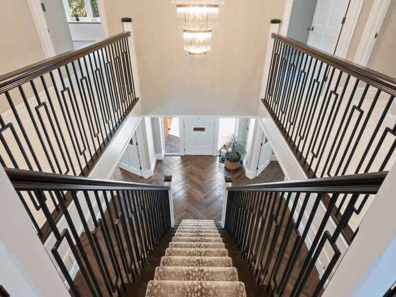 Looking down the staircase to the front door.