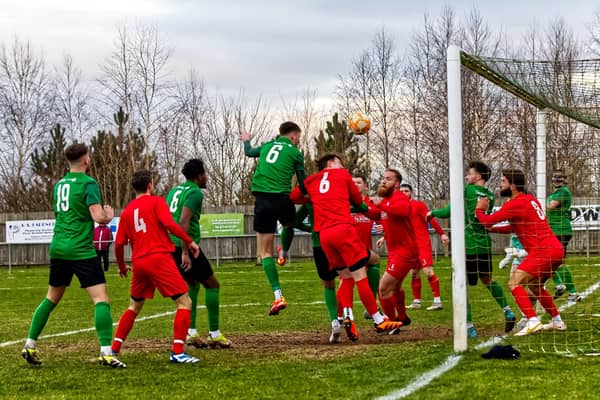 Sebastian Robbemond heads home the opening goal against Heanor. Photo: Steve W Davies Photography.