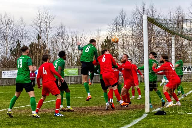 Sebastian Robbemond heads home the opening goal against Heanor. Photo: Steve W Davies Photography.