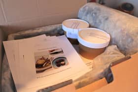 Opening the recipe box after delivery.