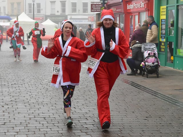 Santas heading through town.