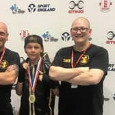 Freddie Carman with club coaches Matthew Mooney and Scott Harmon.