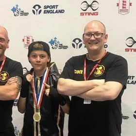Freddie Carman with club coaches Matthew Mooney and Scott Harmon.