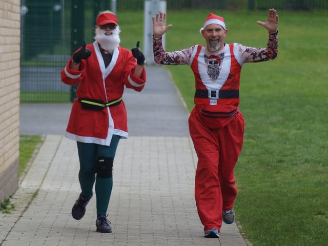 Thumbs up as these Santas complete the course