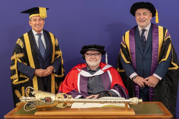 Artist Jason Wilsher-Mills receives his honorary doctorate, pictured with the Loughborough University mace, (left) Chancellor Lord Sebastian Coe and (right) Vice-Chancellor and President Nick Jennings. Photo: Loughborough University
