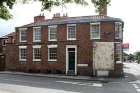 The 'ghost sign', advertising Batemans Ales, on the walls of the former Cross Keys pub on Queen Street in Horncastle. (PHOTO BY: Dave Hitchborne)