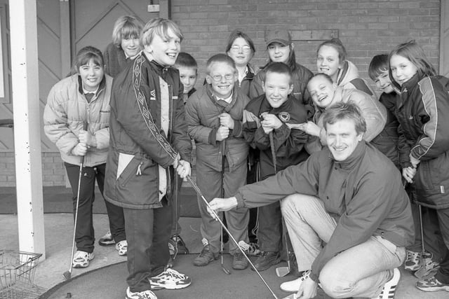 Youngsters from Park Primary School, Boston, paying a visit to Boston West Golf Centre. Professional Andrew Hare is pictured alongside pupil Toby Williamson and classmates at the centre's driving range.