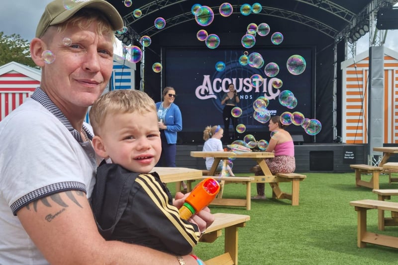 Mark Cater and Freddie, 2, of Bradford on Haven, enjoying music on the outdoor stage.