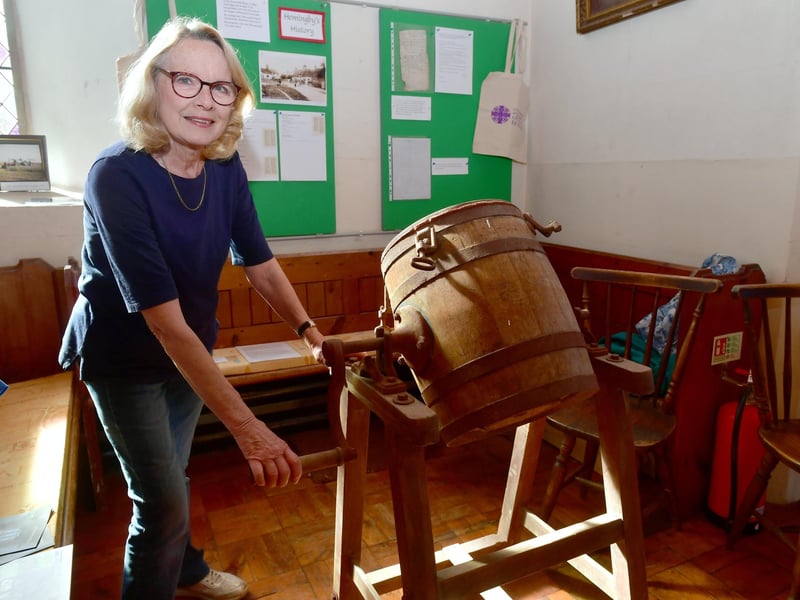 Margaret Irwin of Hemingby trying out an old butter churn.