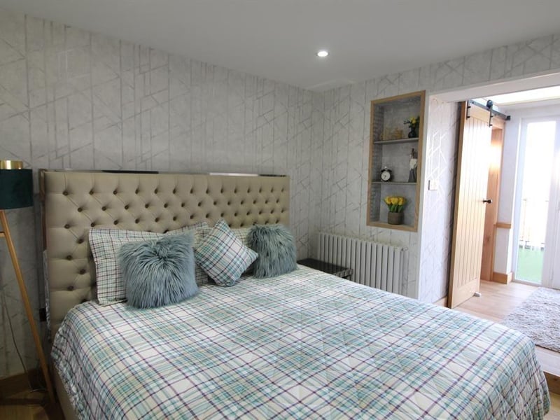 One of the two bedrooms with a balcony.