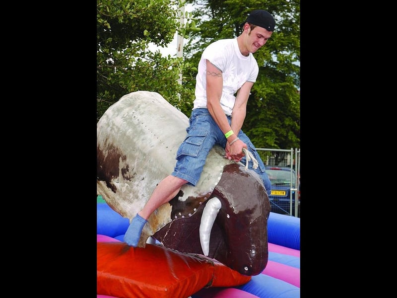 Gediminas Bivainis, riding a mechanical bull.