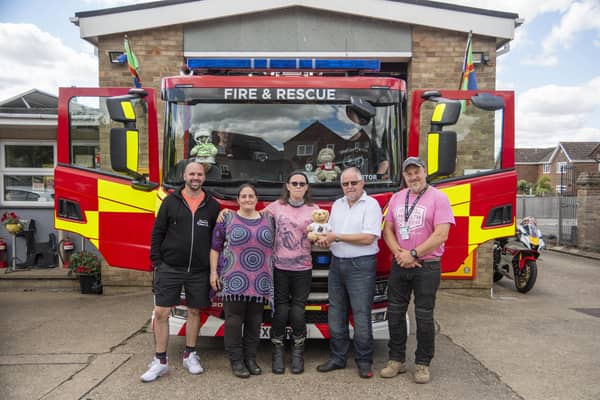 At Caistor fire station. L to R - Tom Hurford (Relay Riders UK founder), Michelle Barrett (Kibi's mum), Michelle Gardner (Kibi's stepmum), biker John Quipp and Paul Oxborough (founder of Mental health motorbike). Photo: Holly parkinson