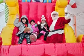 Youngsters enjoy a ride on Santa's inflatable sleigh with the great man himself at Mablethorpe's Christmas market.