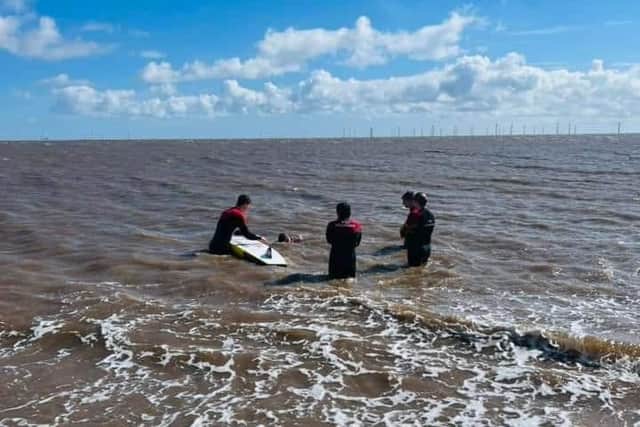 RNLI Lifeguards training in the sea.