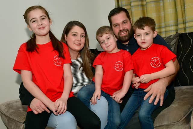 Danielle Ballam and Chris Hough with children, from left, Edith-Rose Ballam, 9, George Hough, 4 and William Hough, 5.