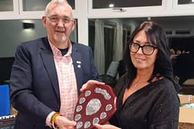 ​Malcom Stimpson, Rotary President, presents the award to Eve Bennett.