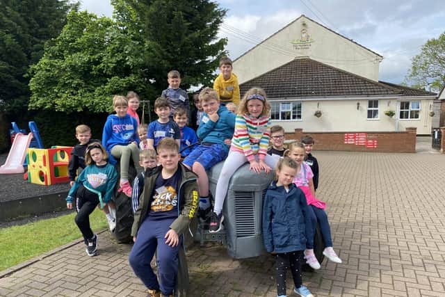 The children getting ready for a day on the farm
