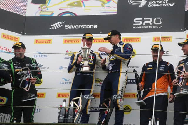 Shaun Balfe and Andy Smalley receive their winner's trophy. Photo submitted.
