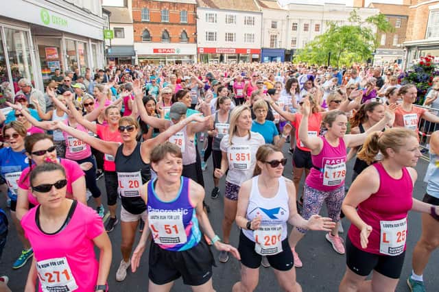 Participants in the women's Run for Life 2022 warming up.