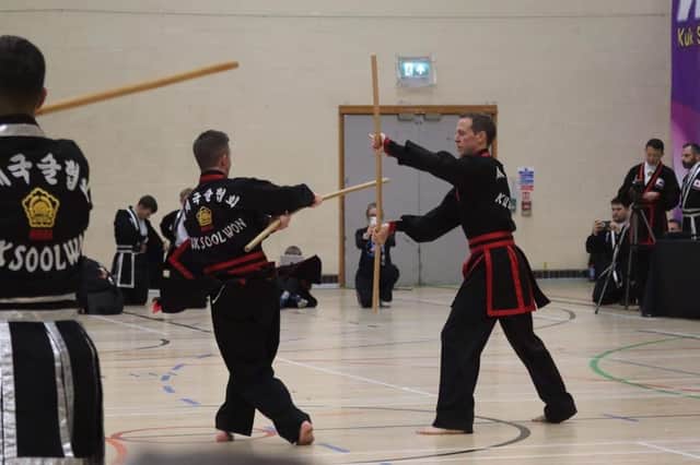 Action from the tournament. Scott Slack and Keith Slack.