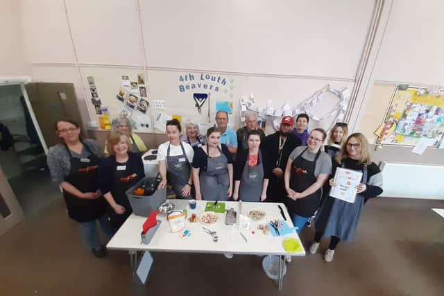 Representatives of Louth & District Lions, Morrisons, and Louth Methodist church and participants during the latest Easy Cook sessions.