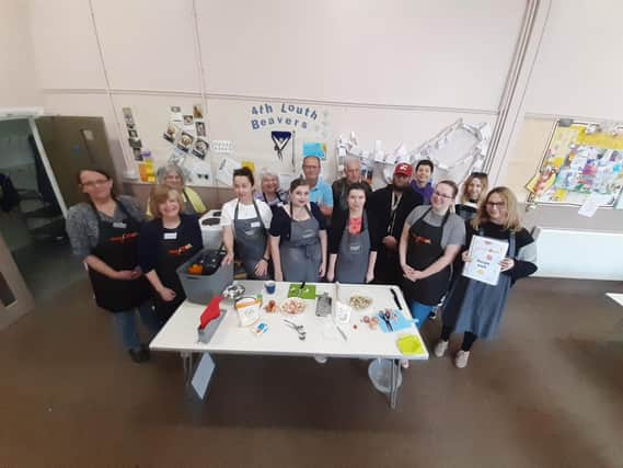 Representatives of ​Louth & District Lions, Morrisons, and Louth Methodist church and participants during the latest Easy Cook sessions.