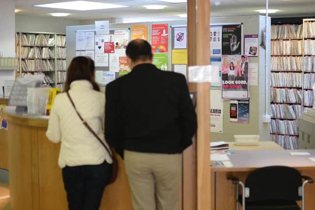 Patients wait at reception at the Temple Fortune Health Centre GP Practice near Golders Green, London.