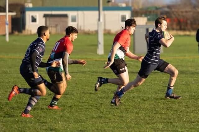 Thomas Loveley scores a try for Boston.