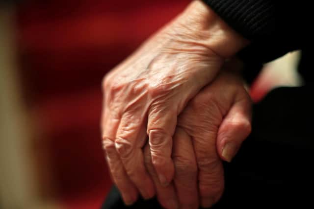 The hands of an elderly woman in Poole, Dorset.