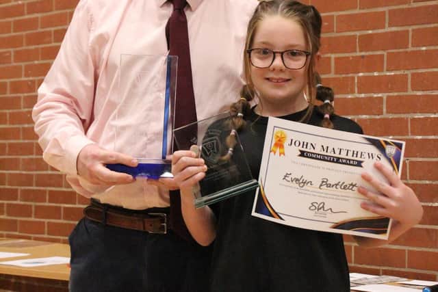 Headteacher Simon Porter with De Aston School Year 7 achiever Evelyn Bartlett receiving her John Matthews Community Award.