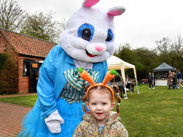 Two-year-old Cali meets the Easter Bunny.