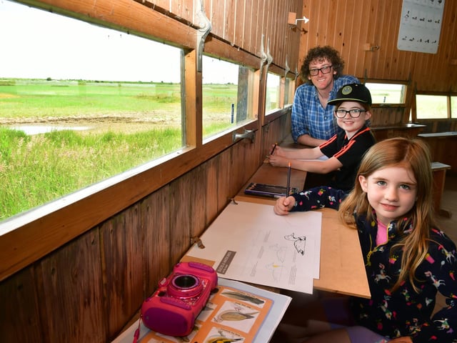 L-R Neil Baker - artist and film maker at Electric Egg, running a sketching workshop in the 360 degree hide, Georgia Booth 7 and Eloise Booth 5