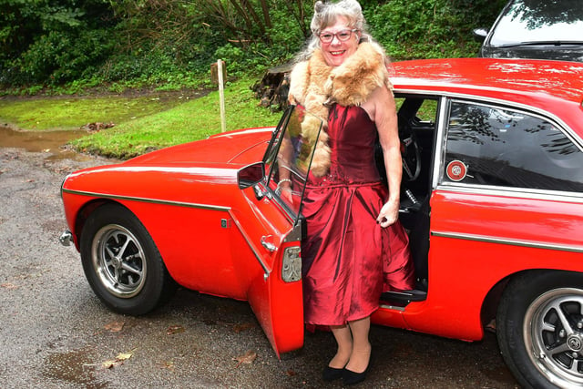 Sharon Vasse arrives at church in a vintage car.