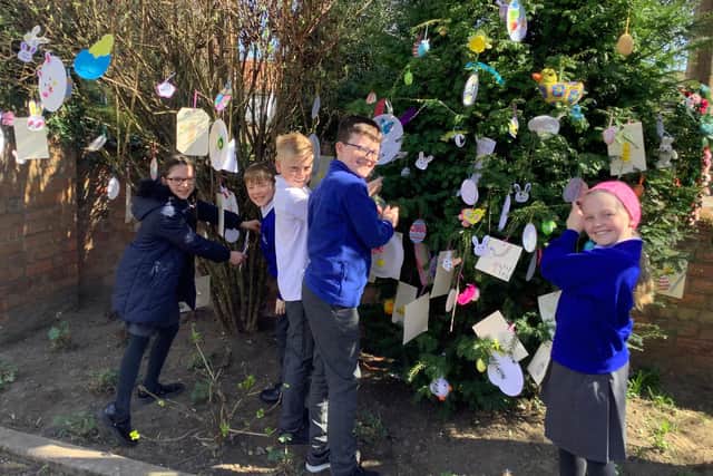 Pupils from Morton Trentside Primary School made and hung decorations on Eliot House's Easter Tree