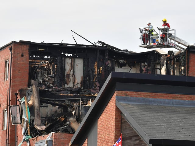 The scene on Wednesday morning as the fire service inspected the site.