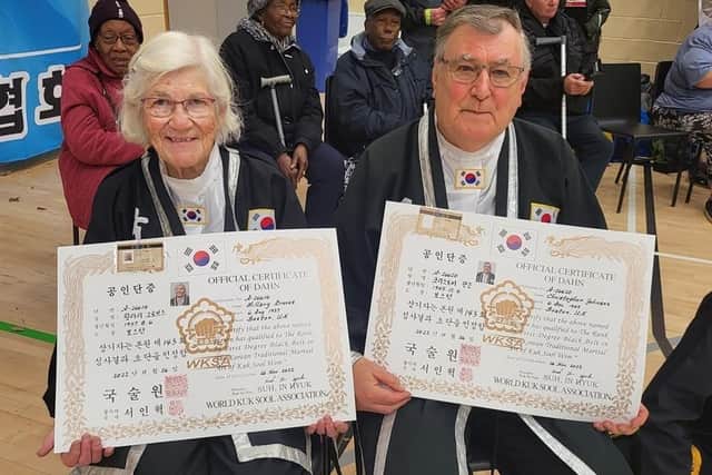 Hilary Groves and Chris Johnson, of Boston's Kuk Sool Won, with their black belt certificates, presented to them at the WKSA UK Championships in Liverpool last month.