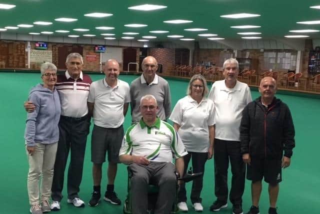 The winners and losing finalists of Boston Indoor Bowls Club's Open 3-Wood Drawn Triples competition, with the organisers, Carol Dowse (extreme left) and Mark Brown (extreme right)