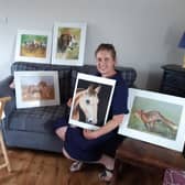 Angela Watson with some of her artwork.