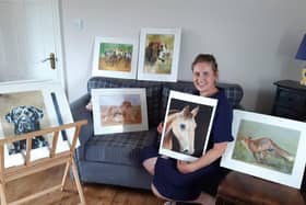 Angela Watson with some of her artwork.
