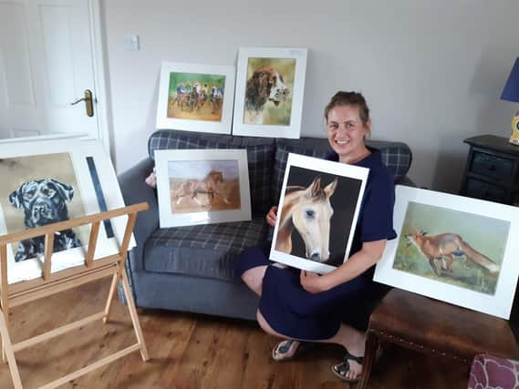 Angela Watson with some of her artwork.