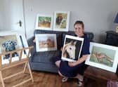 Angela Watson with some of her artwork.