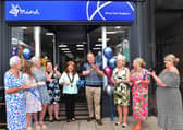 Mayor Coun Julia Simmons (centre) opens the new Mind shop with regional manager Keven Willows (third right). Photo: Mick Fox