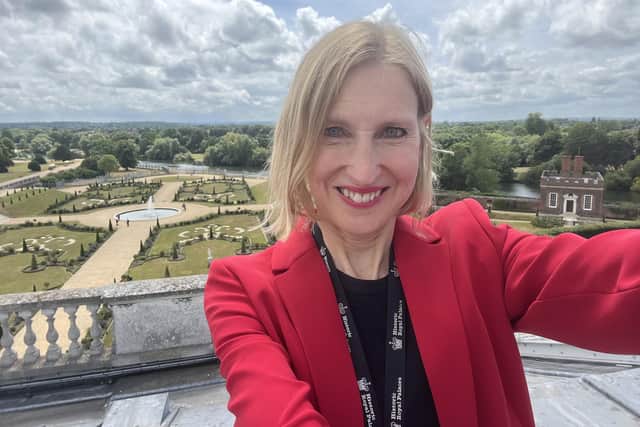 Tracy Borman takes a selfie on the roof of Hampton Court Palace.