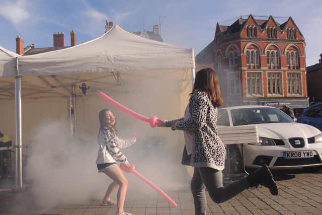 A smoke machine added to the atmosphere at the free Halloween event in Boston Market Place.