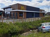 A car in the ditch next to the new McDonald's off the A52 near Tesco.